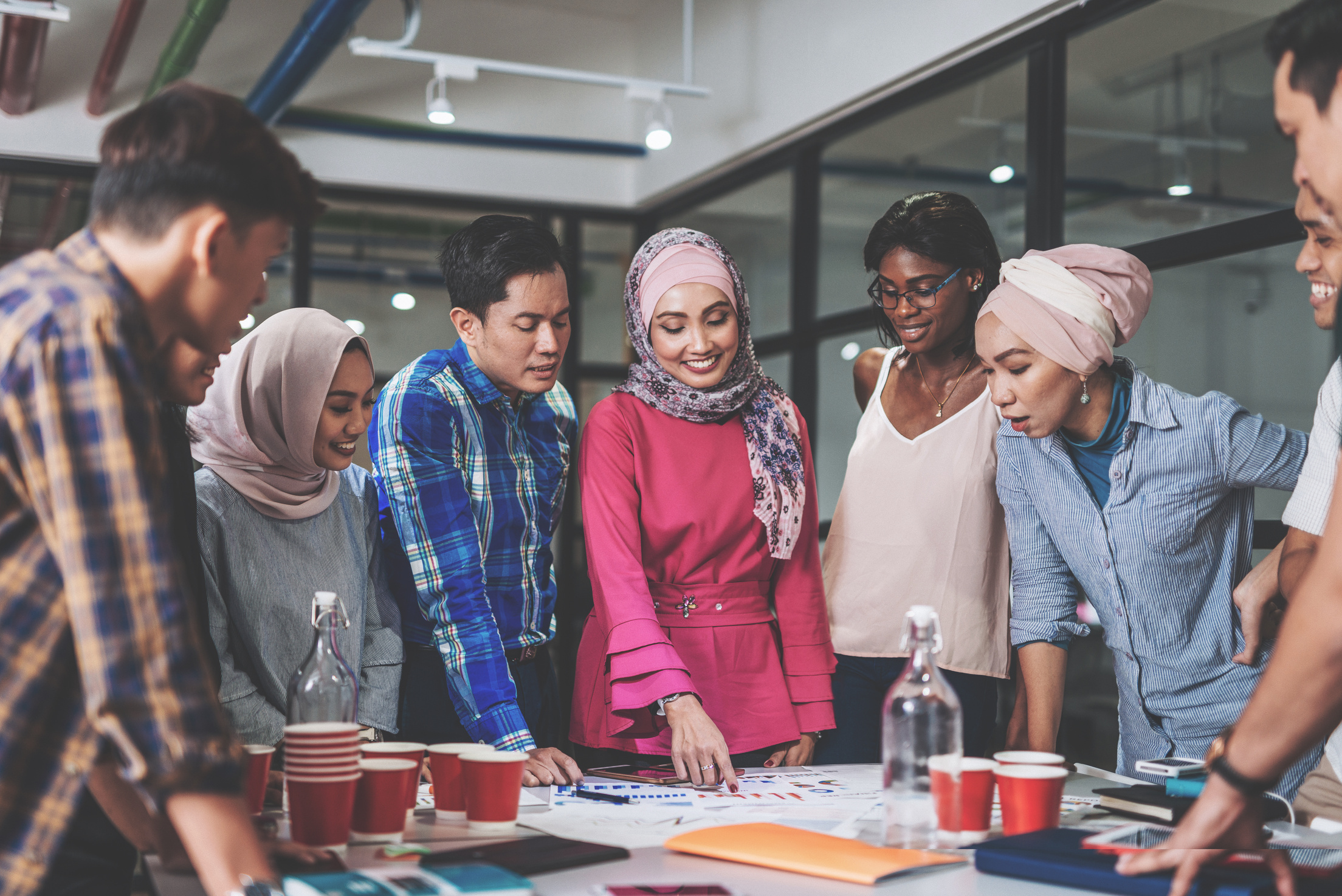 Business coach motivates employees.